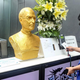A golden bust of Steve Jobs displayed at a Shanghai Company